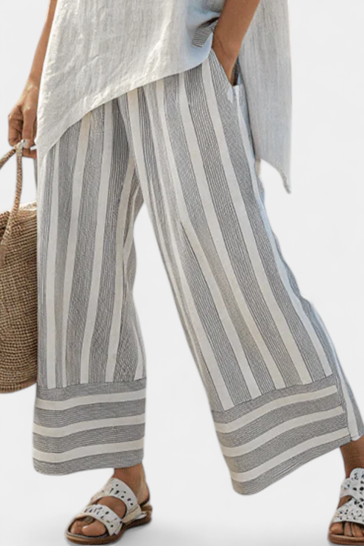 Fiorella – blusa asimmetrica elegante e pantaloni a righe